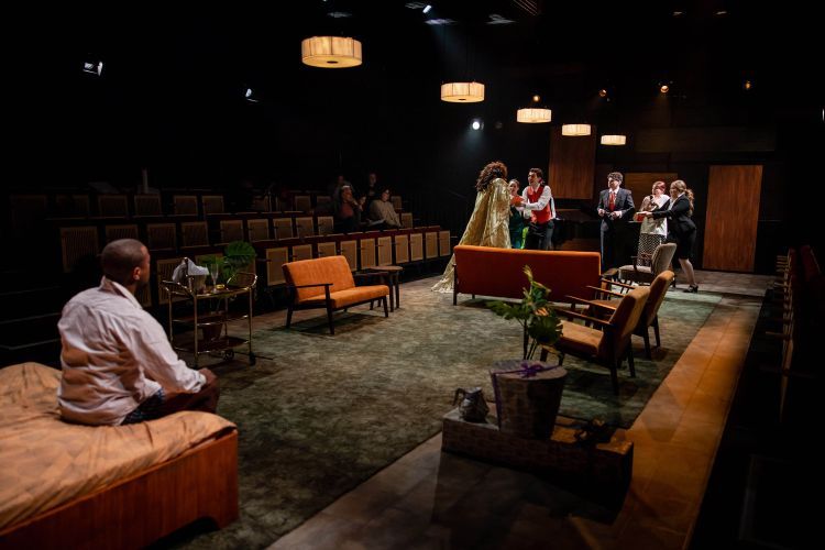 Long set of opera scenes with couches, chairs and tables